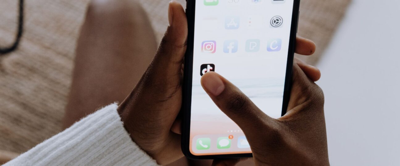 Someone accessing the TikTok app on a smartphone.